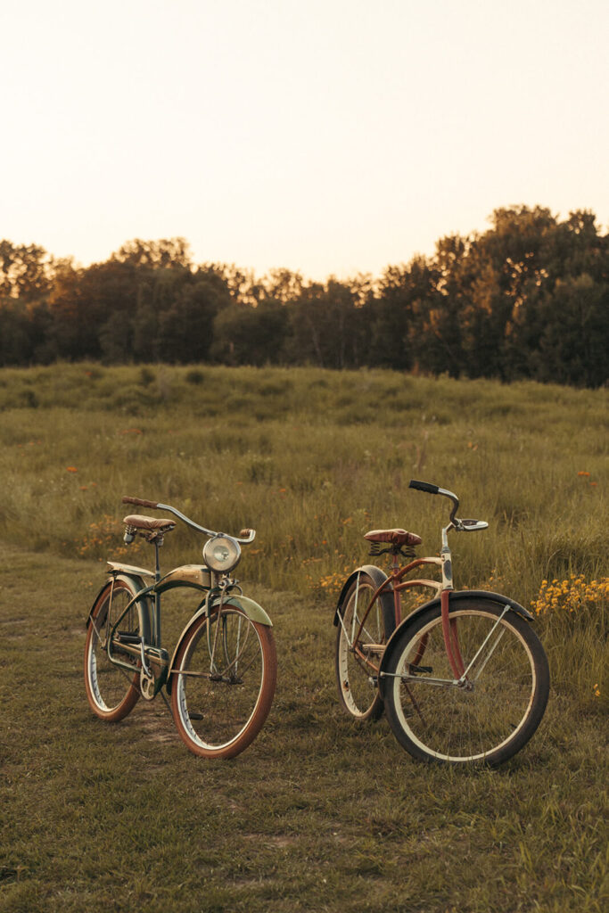 Classic, old-timey bikes rest in Minnesota meadow.