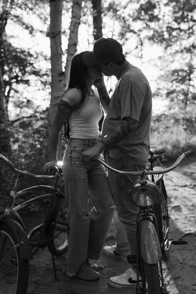 Engaged couple kisses in White Bear Lake, Minnesota.