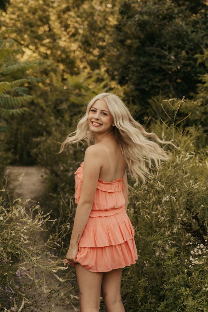 Senior photos Minneapolis with high school girl wearing coral sundress