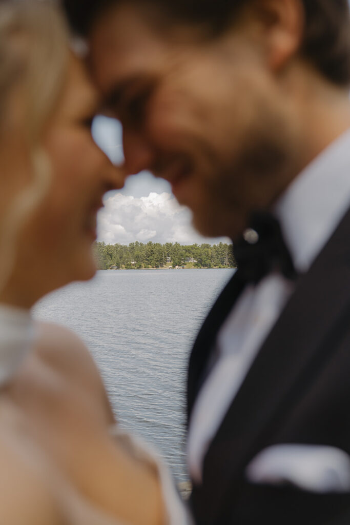 Bride and groom touch foreheads at Catalyst by Nature Link in Nisswa, Minnesota