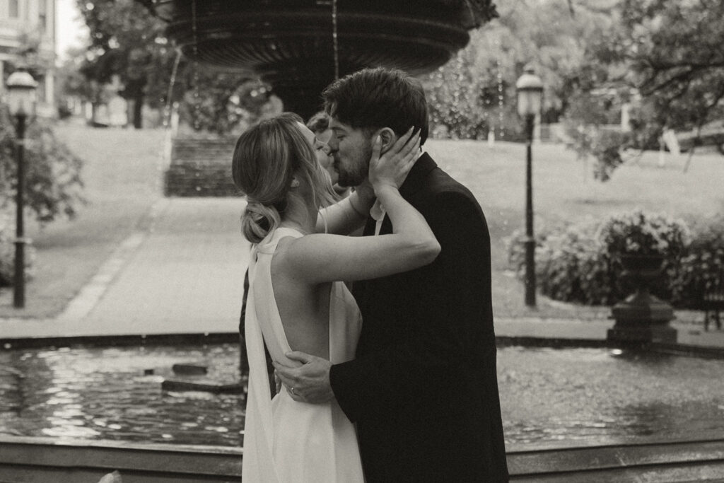 Couple embrace after sealing their vows with a kiss at their Minnesota elopement.
