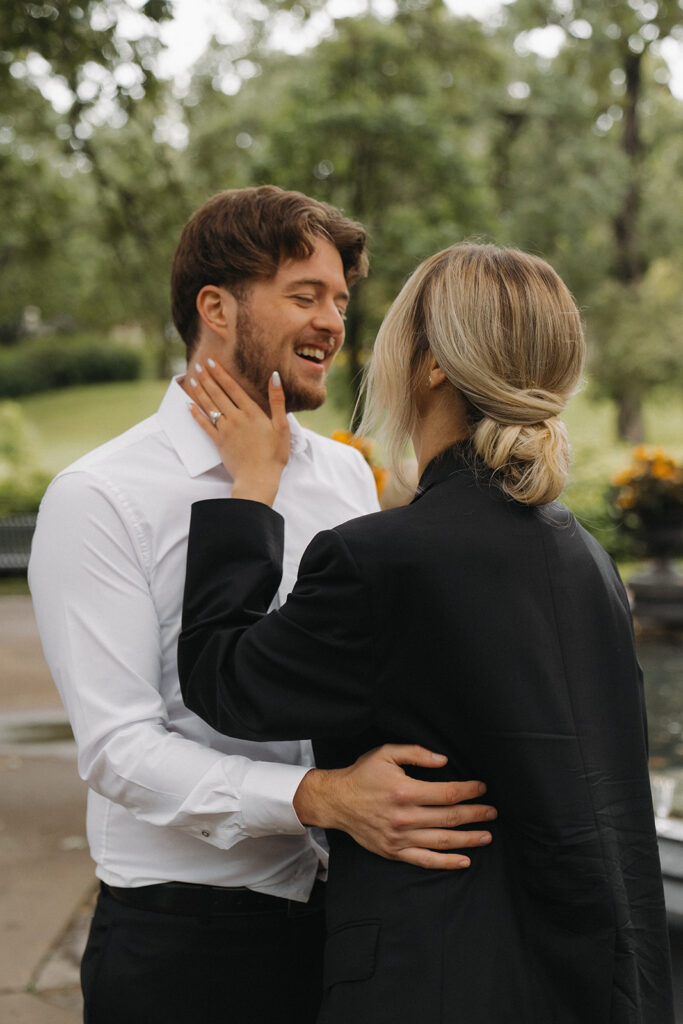 Bride and groom laughing close together in candid elopement photos at Irvine Park.