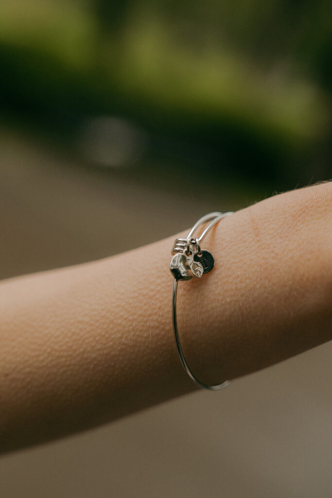 Close-up of Polina’s bracelet captured in timeless Irvine Park wedding photos.