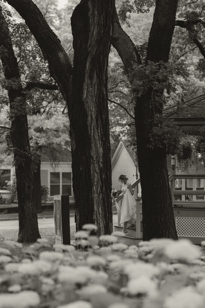 Bride walking down gazebo in Irvine Park to her wedding ceremony.