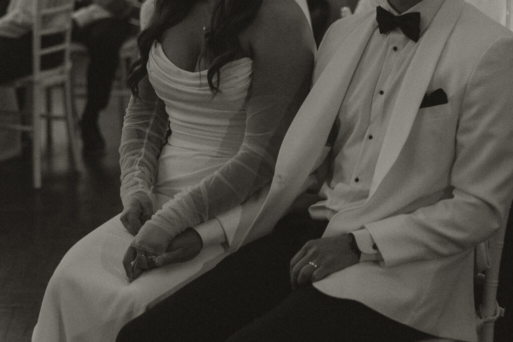 Close-up of the bride and groom holding hands during a timeless Twin Cities wedding celebration.
