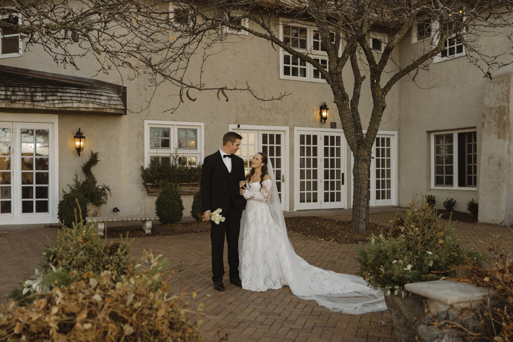 Vintage wedding aesthetic captured in couples portrait in the Edward Anne Estate courtyard