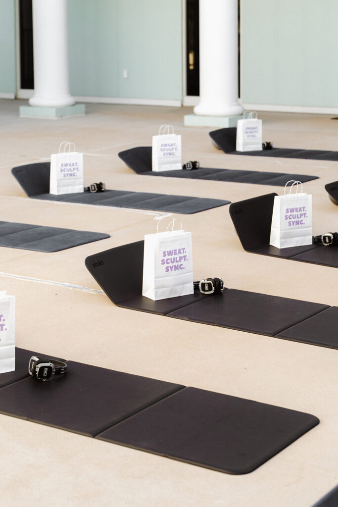 Pilates mats prepared for Garnuu wellness event with branded gift bags, experiential branding photos.
