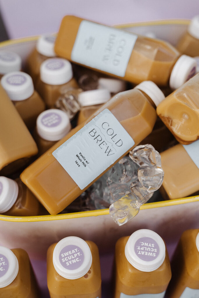 Cooler filled with cold brew bottles at Garnuu event, candid brand photoshoot detail.