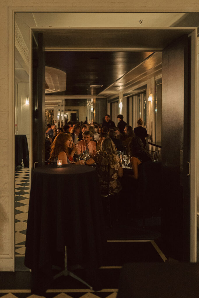 Wedding guests enjoy conversation and cocktails at intimate wedding reception in Saint Paul, Minnesota